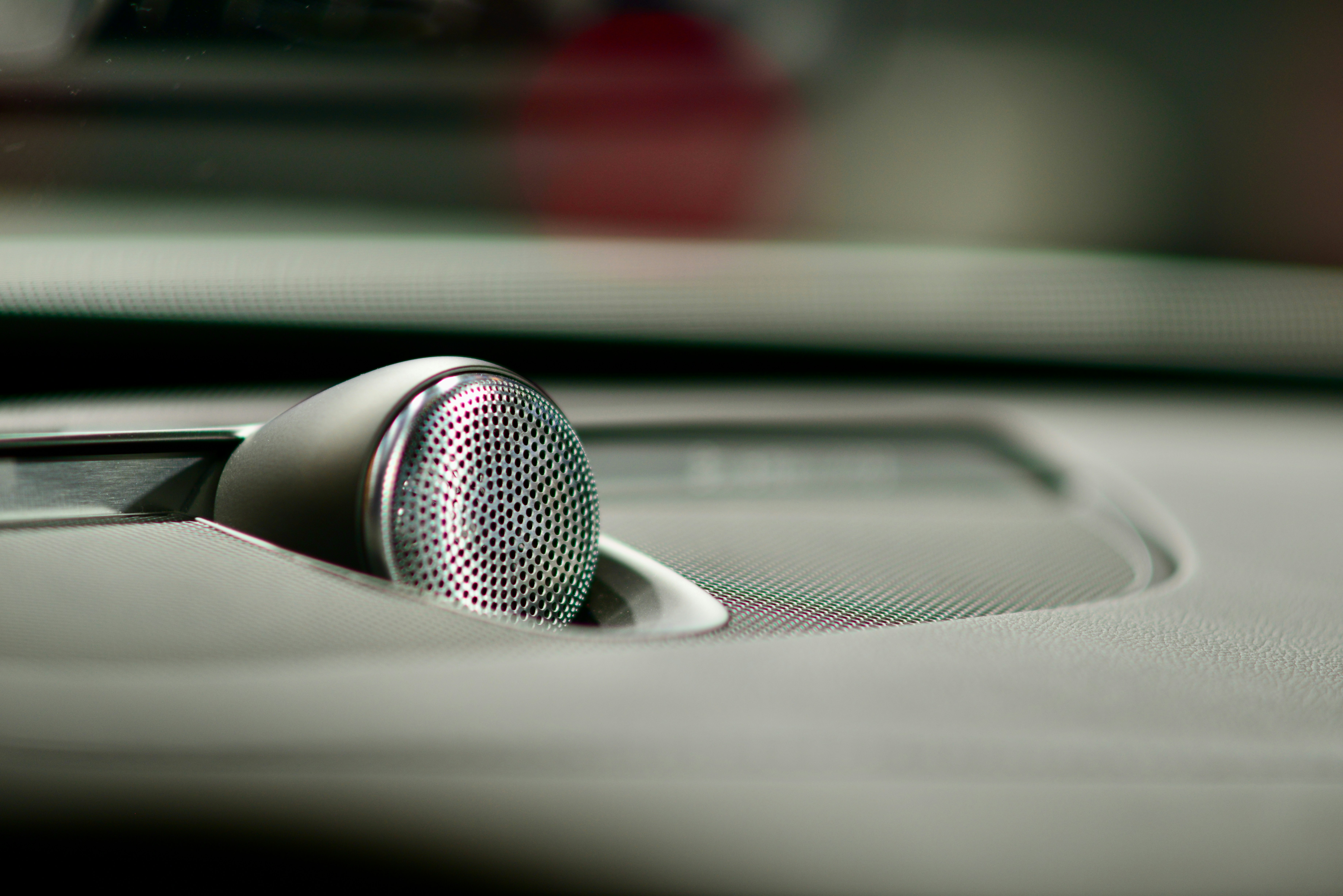 a close up of a speaker on a car dashboard