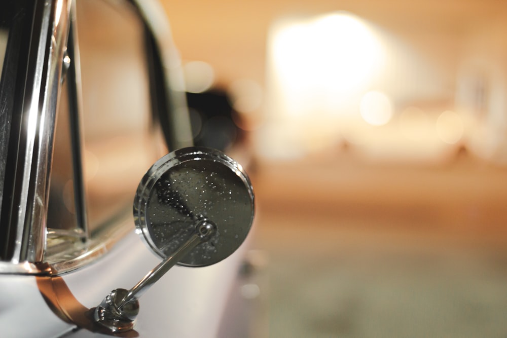 a close up of a mirror on a car