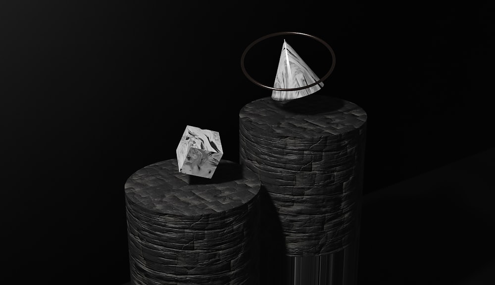 a black and white photo of two vases