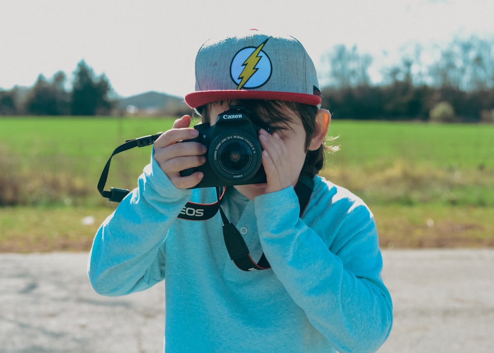 a person taking a picture with a camera