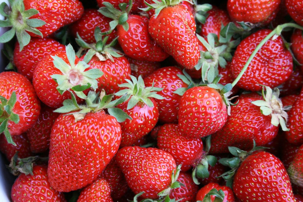 a close up of a bowl of strawberries