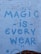 A brick wall with a graffiti-style message painted in blue, reading 'Magic is Everywhere' with playful symbols like dots and small stars accenting the letters.