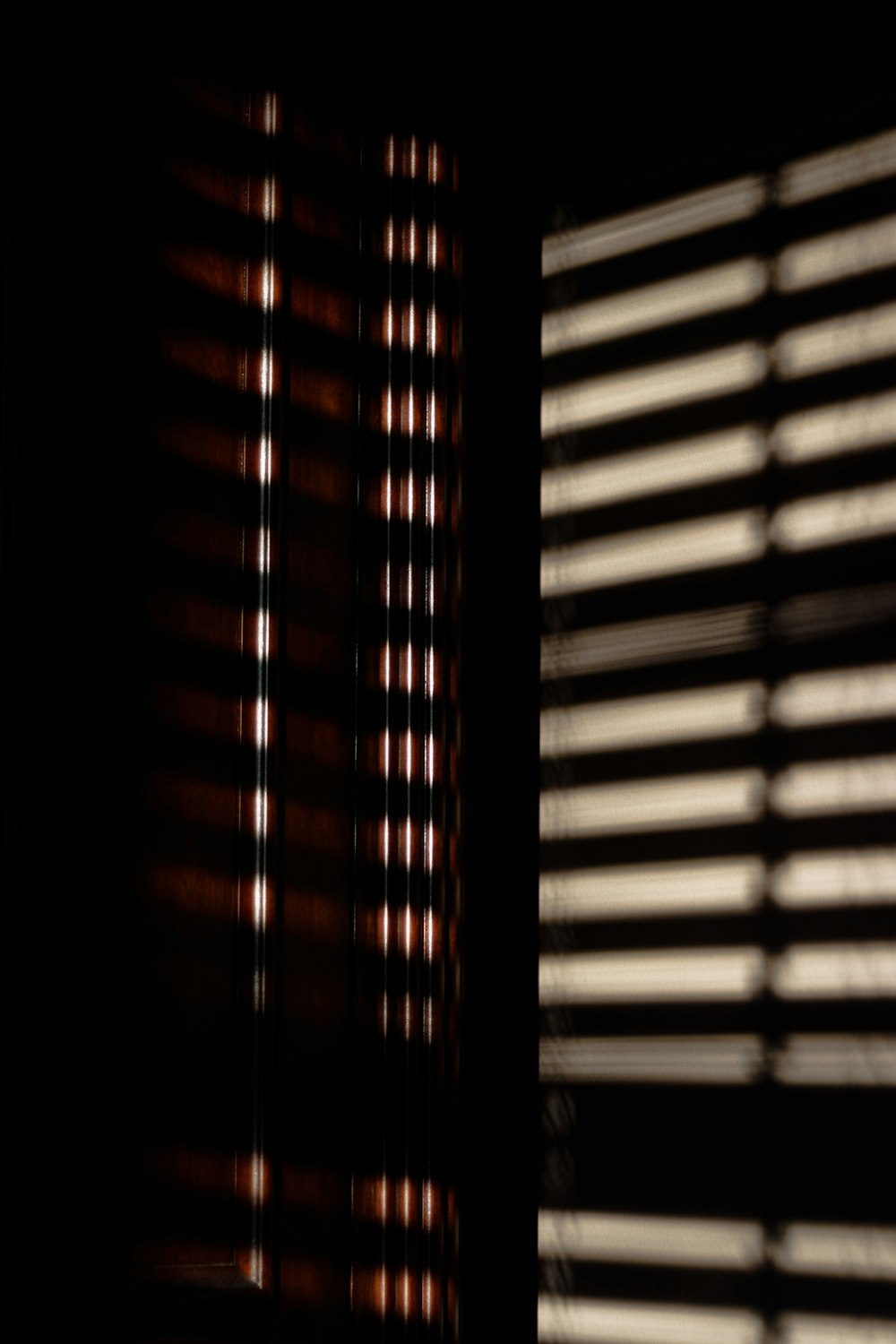 a close up of a window with blinds on it
