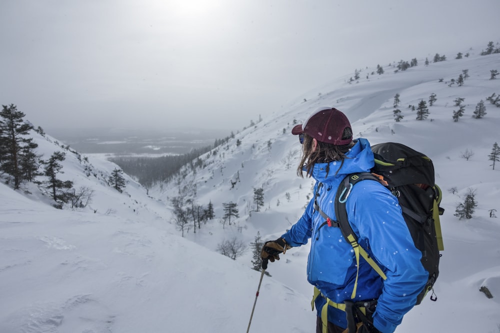 a person on skis on a snowy mountain