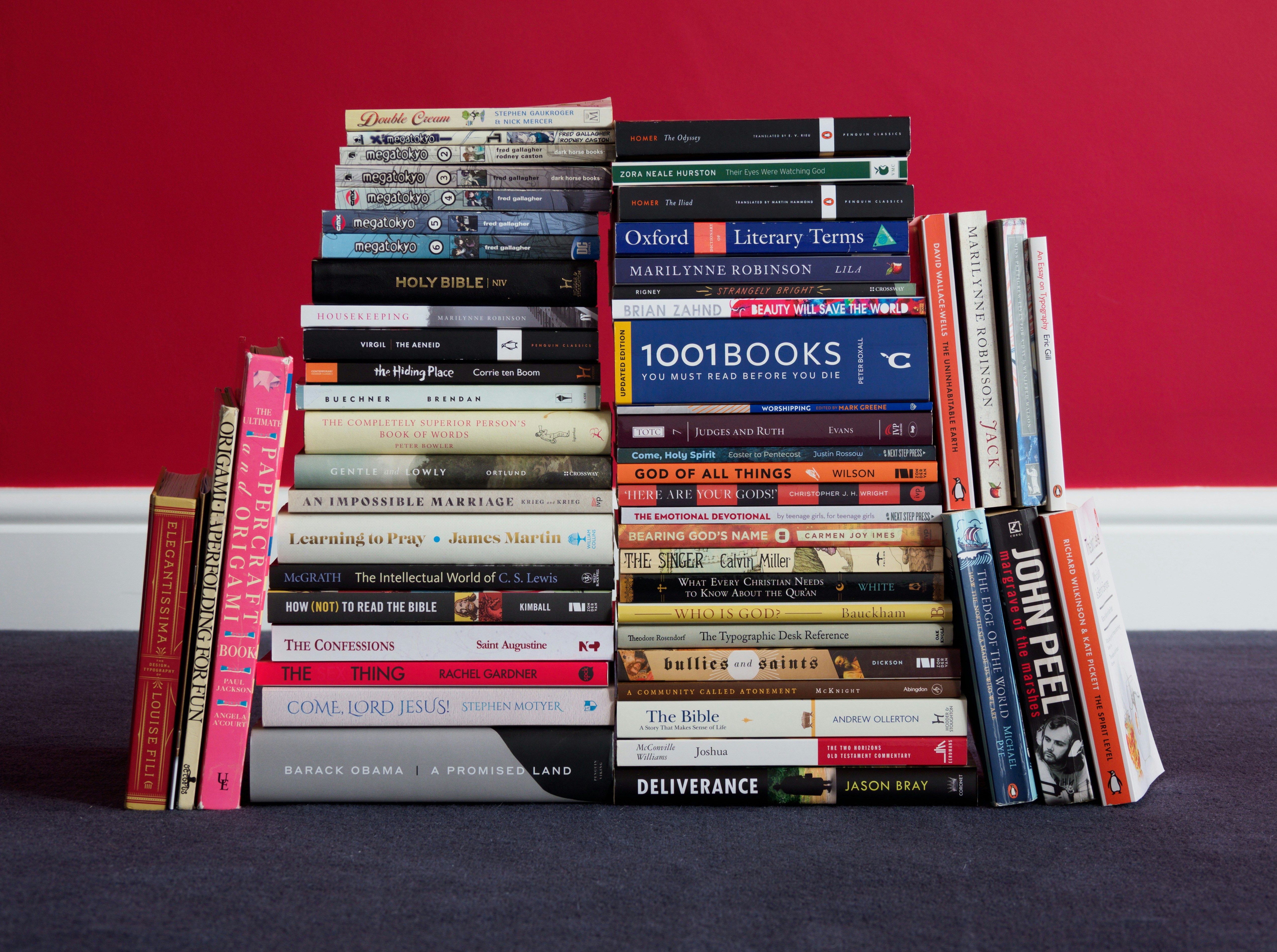 a stack of books sitting on top of a floor