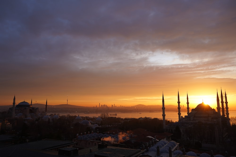 the sun is setting over the city of turkey