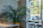 A cozy Scandinavian-style restaurant corner with warm lighting and fresh herbs on the windowsill.