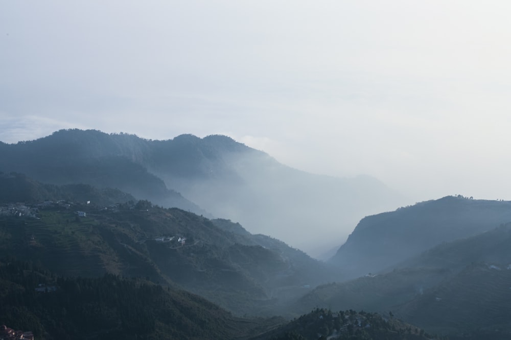 a view of a valley with mountains in the background