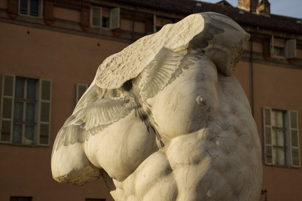 a statue of an elephant in front of a building