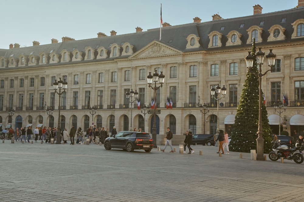 a large building with a christmas tree in front of it