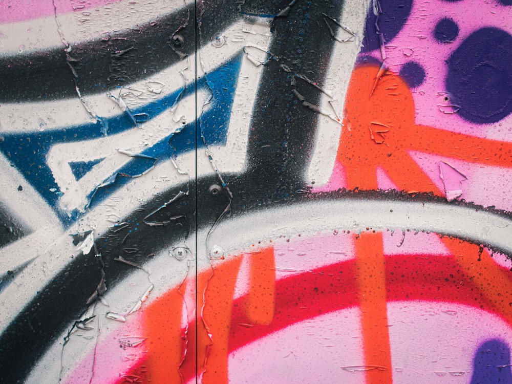 a close up of graffiti on a wall