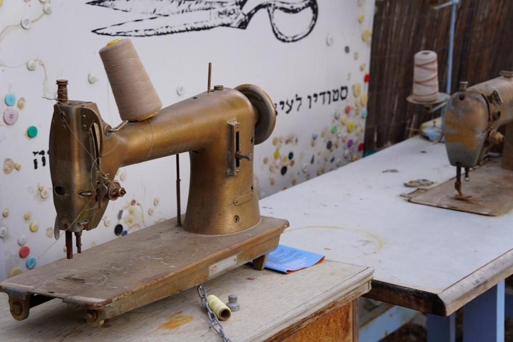 a sewing machine sitting on top of a wooden table