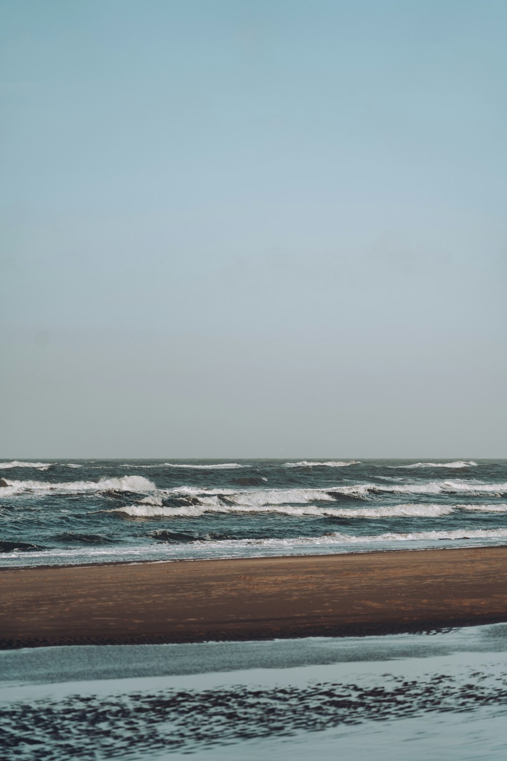 a beach next to the ocean