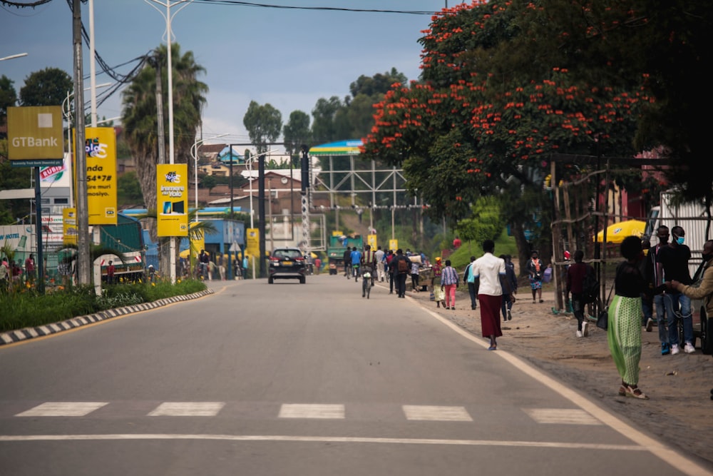 a group of people walking down a street