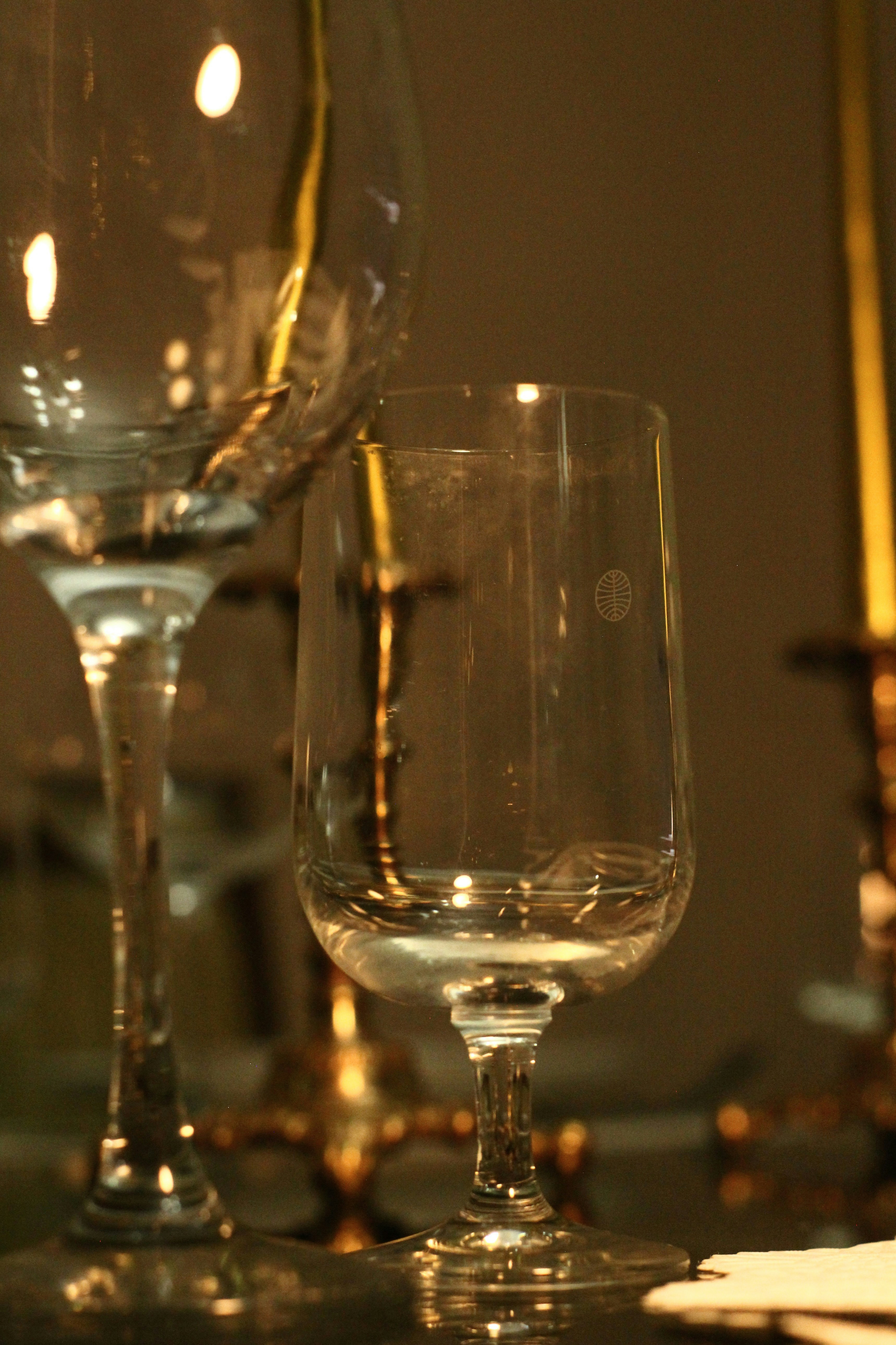 A set of four ornate crystal glassware pieces.