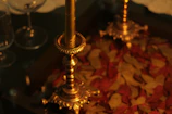 Elegant brass candle holders arranged on a polished marble table.