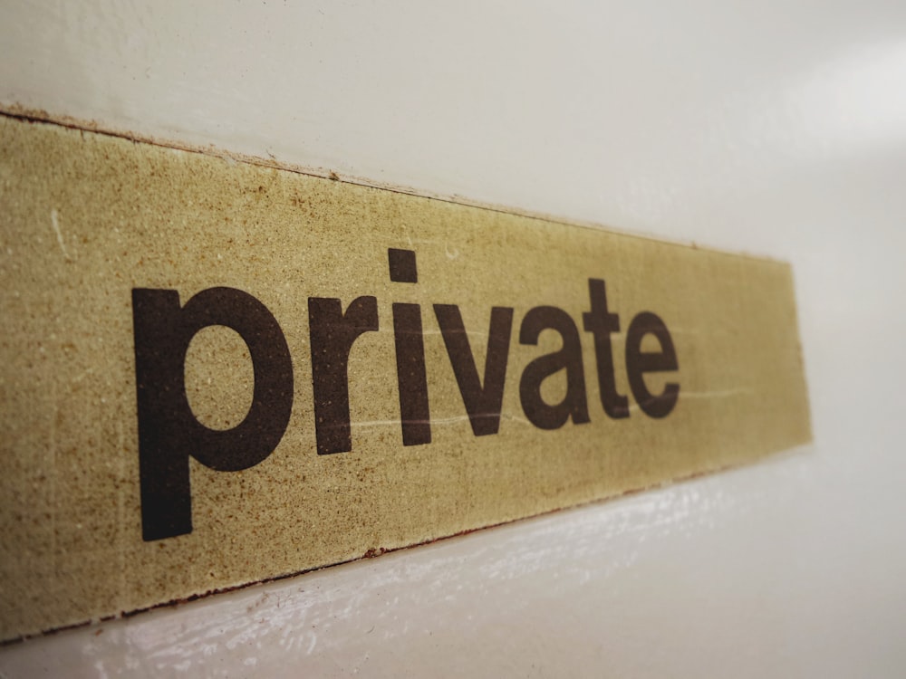 a wooden sign that says private on it