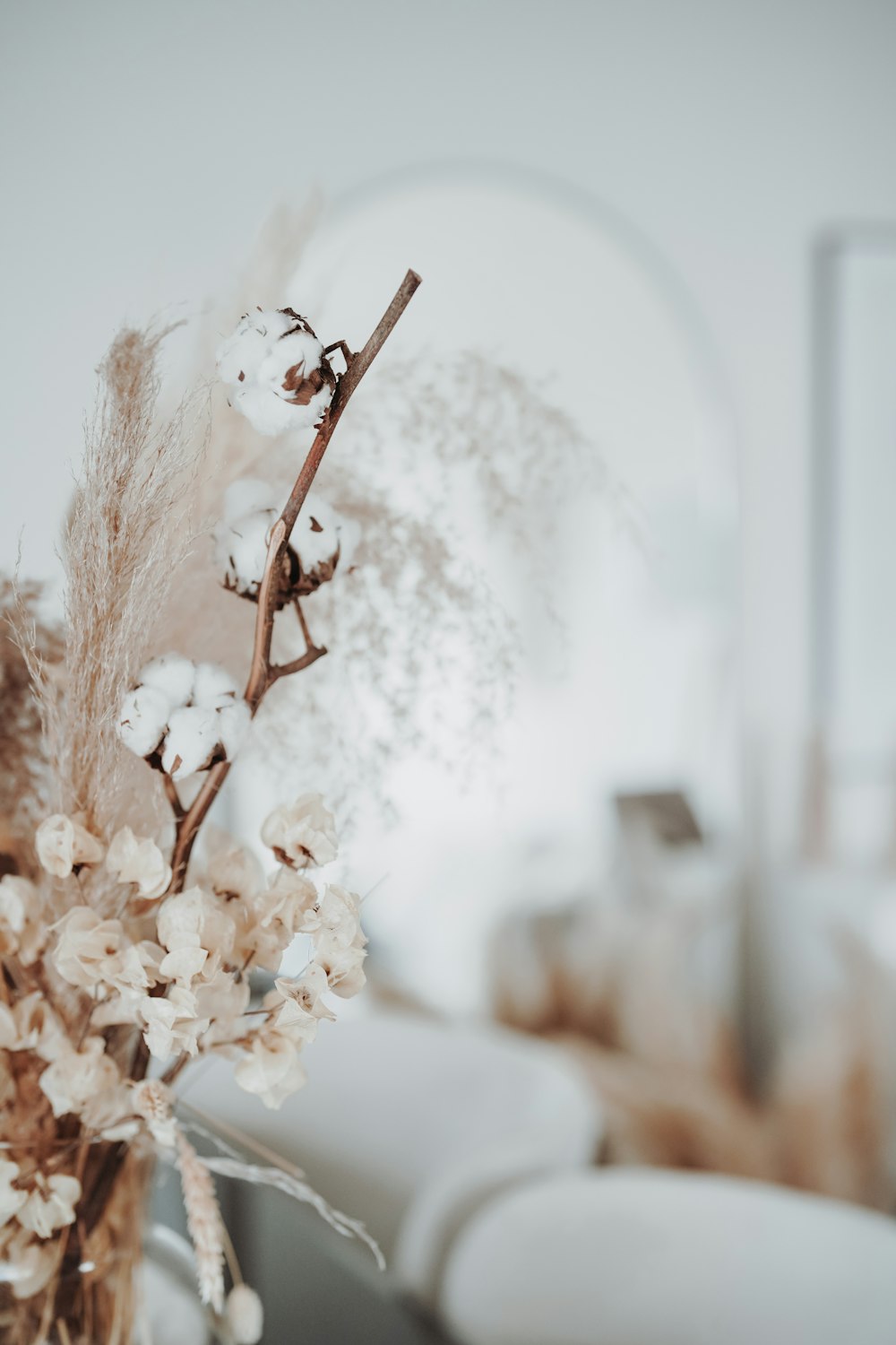 a close up of a vase with flowers in it