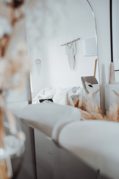a bed room with a bed and a mirror