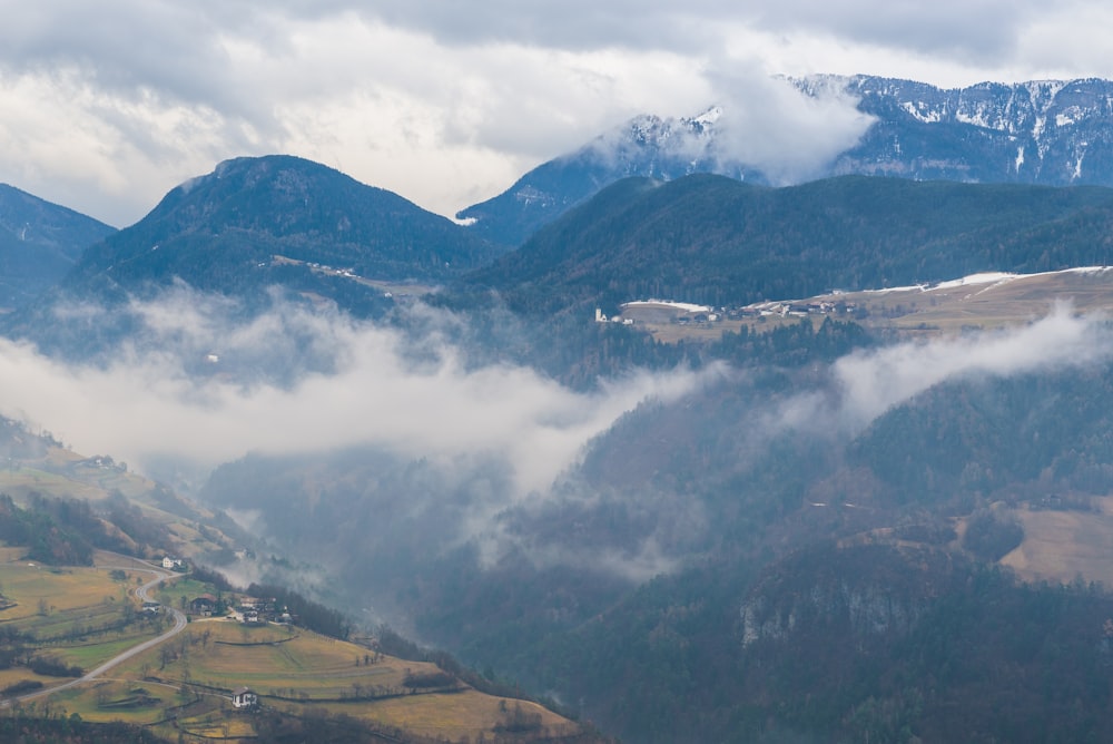 a view of a valley with mountains in the background