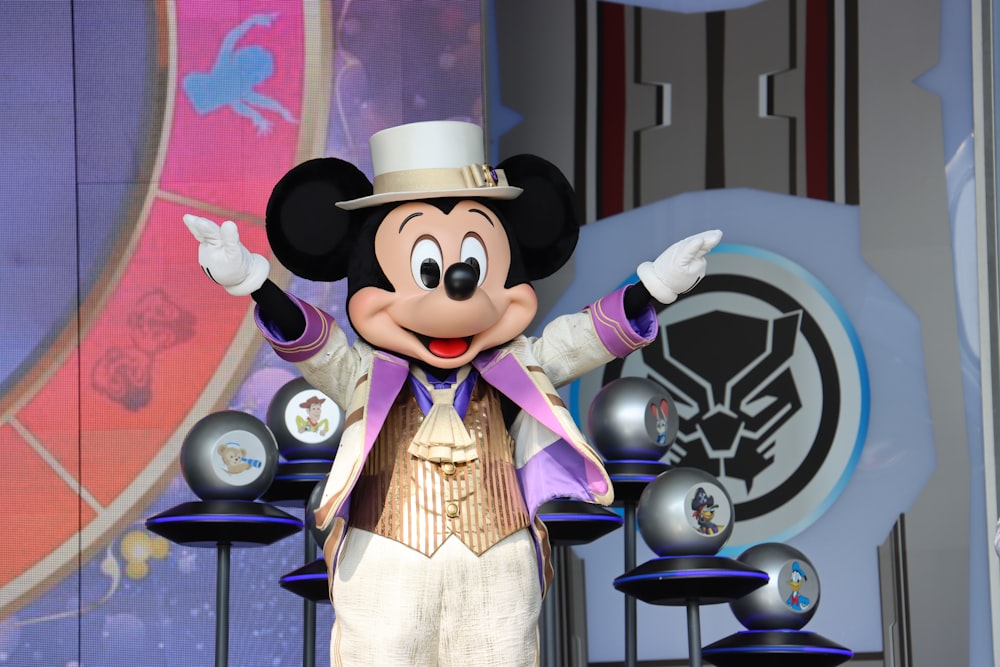 a mickey mouse dressed in a top hat and suit