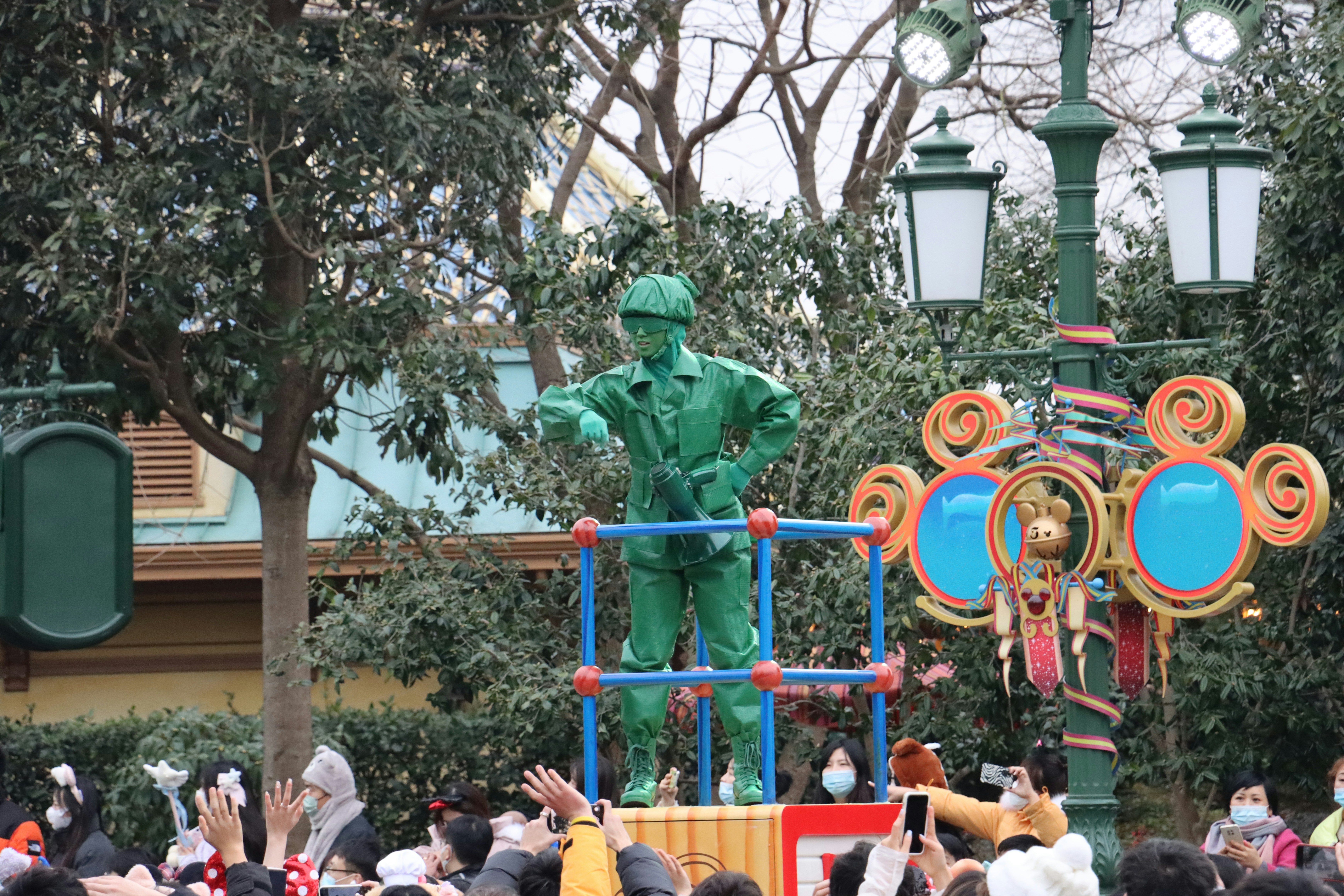 a statue of a man in a green suit on a playground