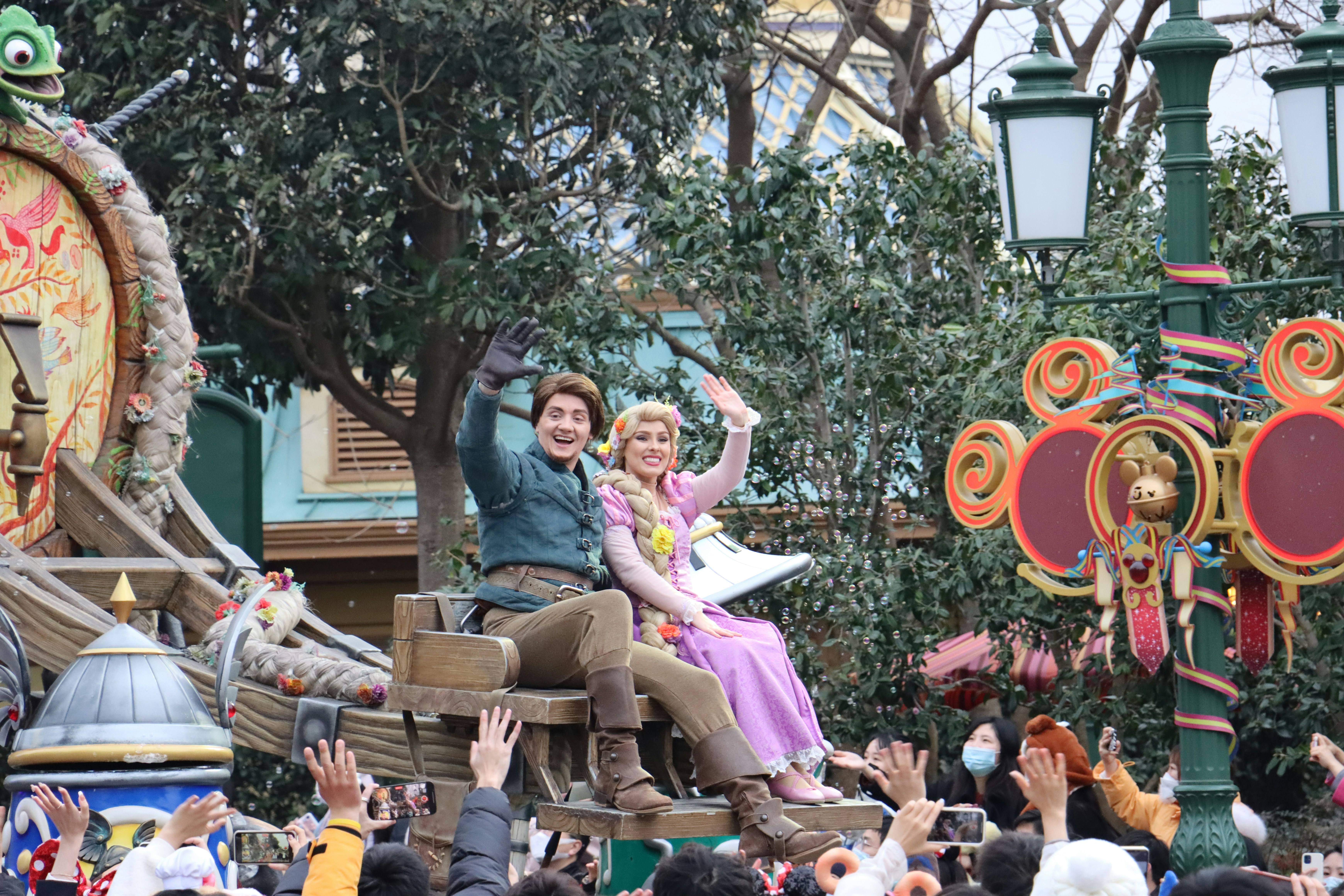 a man and a woman riding on the back of a horse drawn carriage
