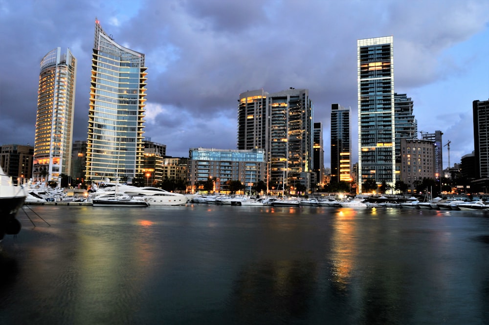 a city skyline with boats in the water