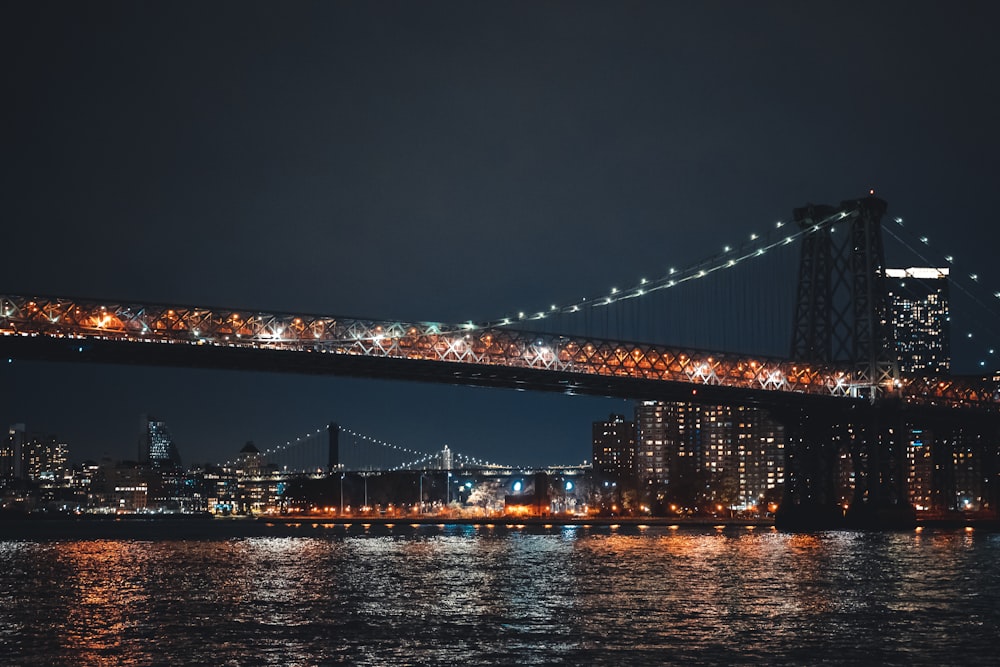 a bridge over a body of water at night