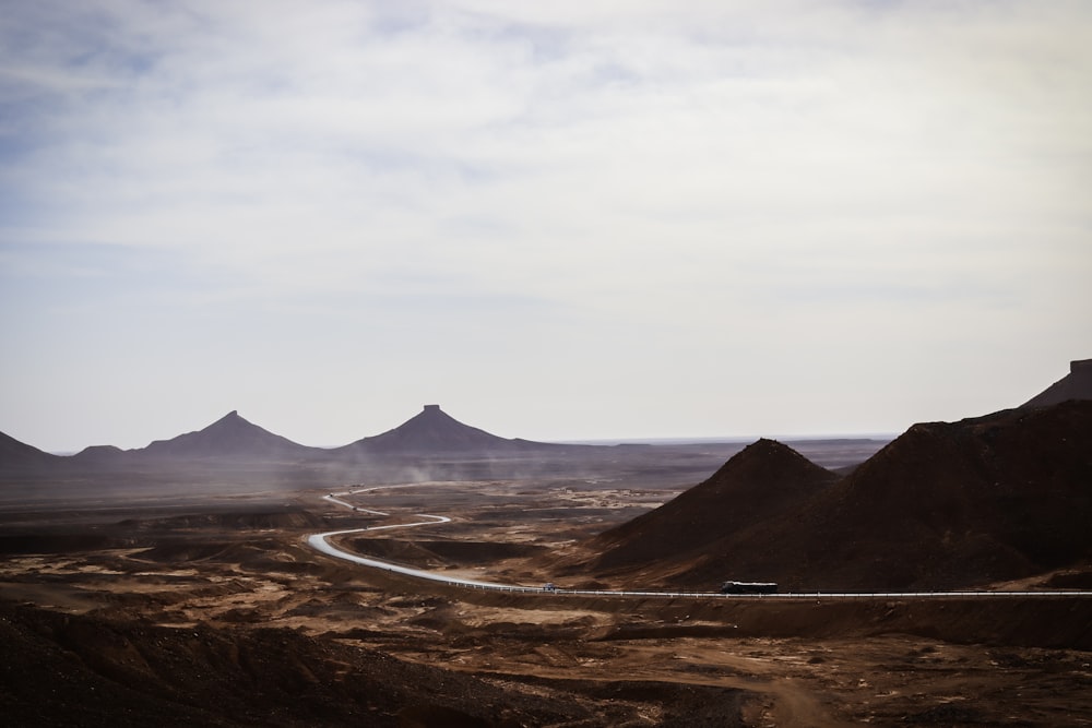 a winding road in the middle of a desert