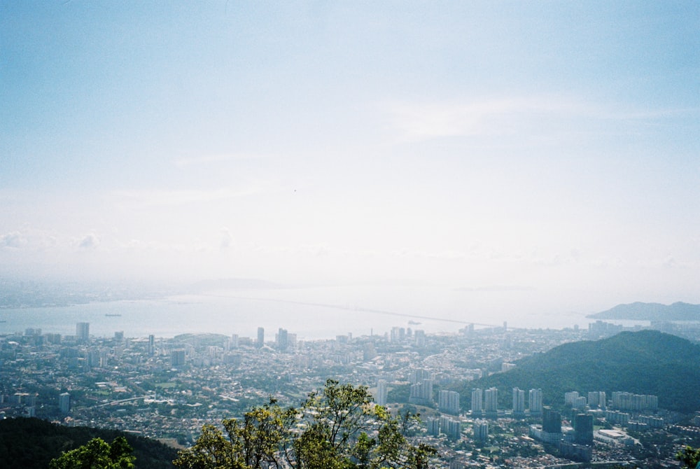 a view of a city from the top of a hill