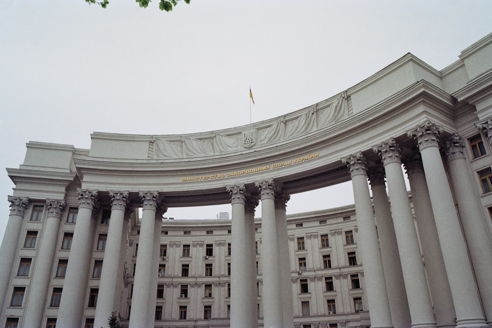 a large white building with columns and arches