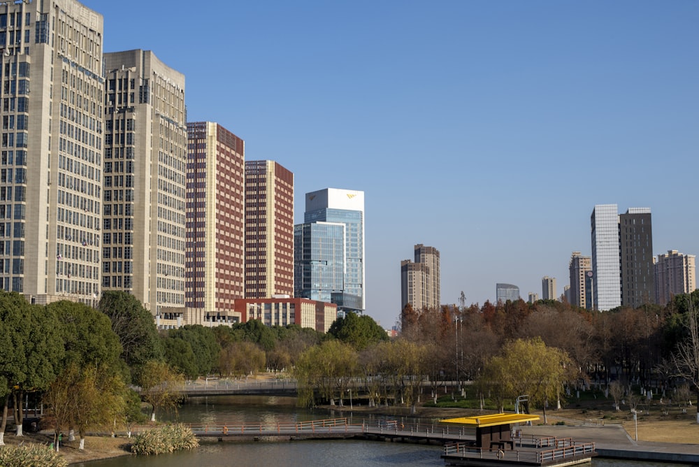 a boat is in the water in front of tall buildings