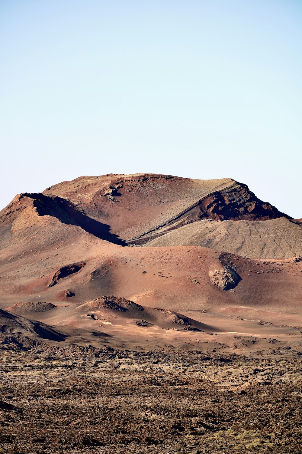 a mountain range with a few hills in the distance