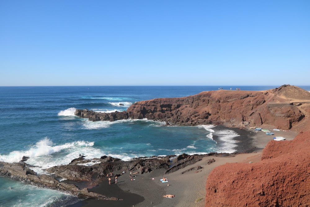 a view of the ocean from the top of a hill