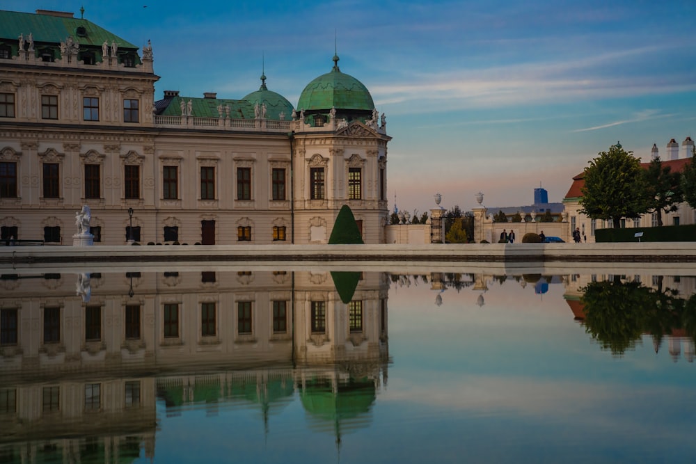 a reflection of a building in the water