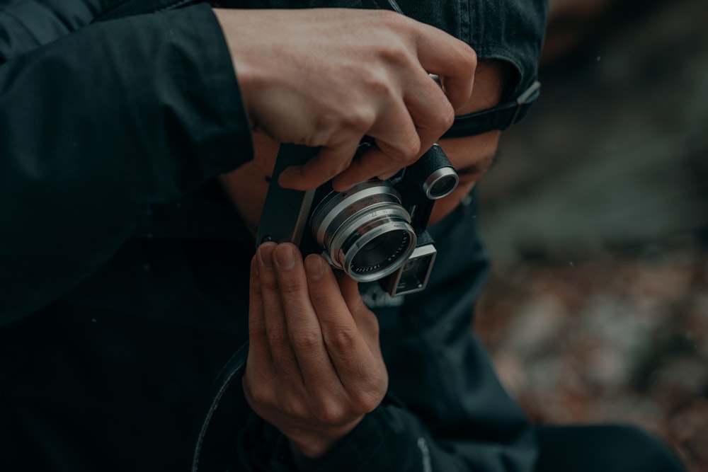 a person holding a camera in their hands