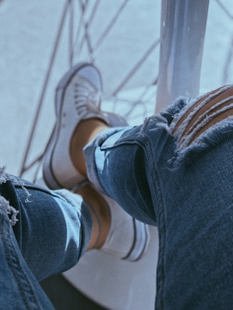 a person sitting on top of a metal pole