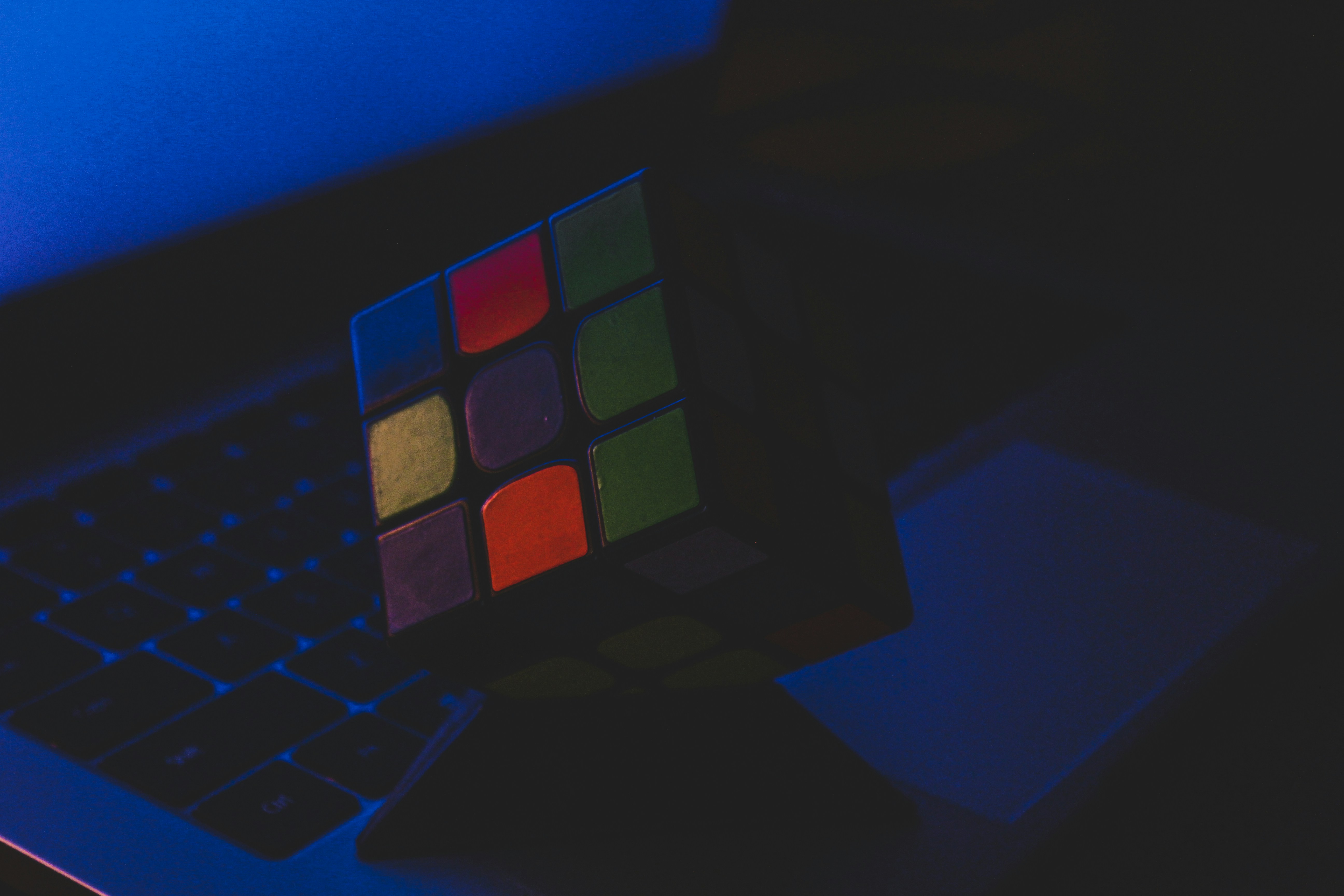 A rubik cube sitting on top of a laptop computer photo – Free Budapest ...