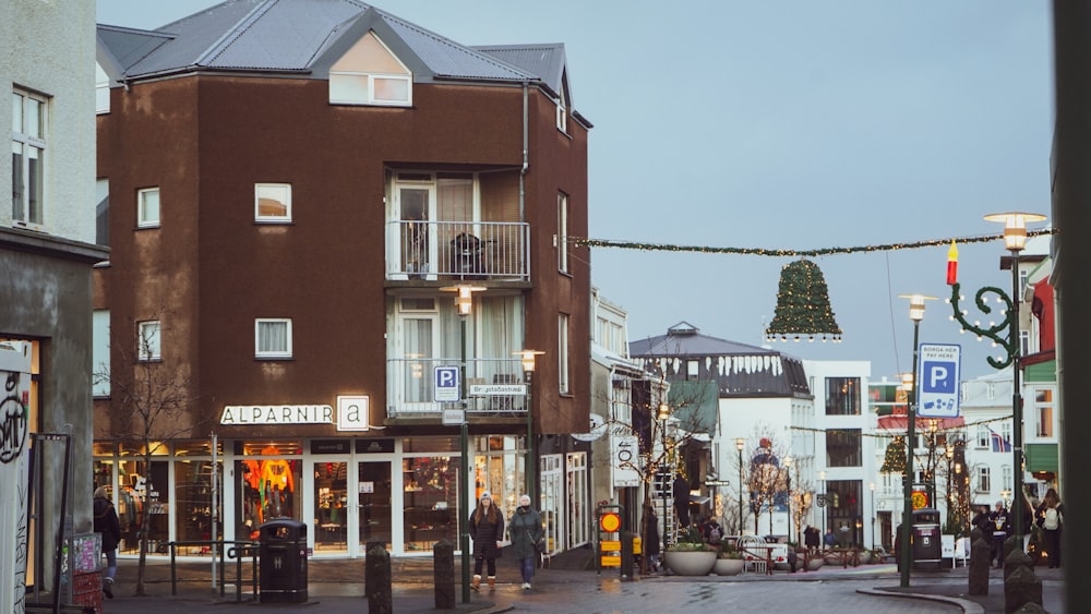 a city street with a christmas tree in the background