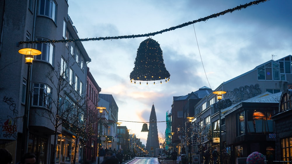 a city street with a christmas tree hanging from the ceiling