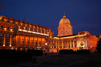 a large building with a dome lit up at night