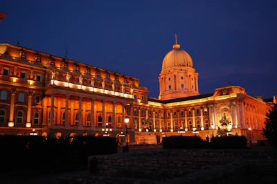 a large building with a dome lit up at night