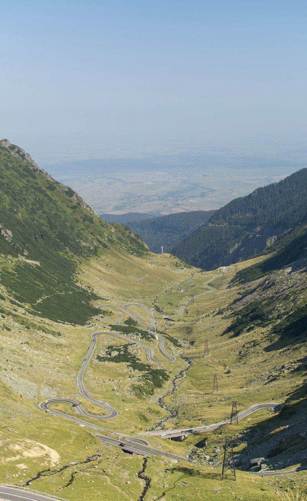 a view of a winding road in the mountains