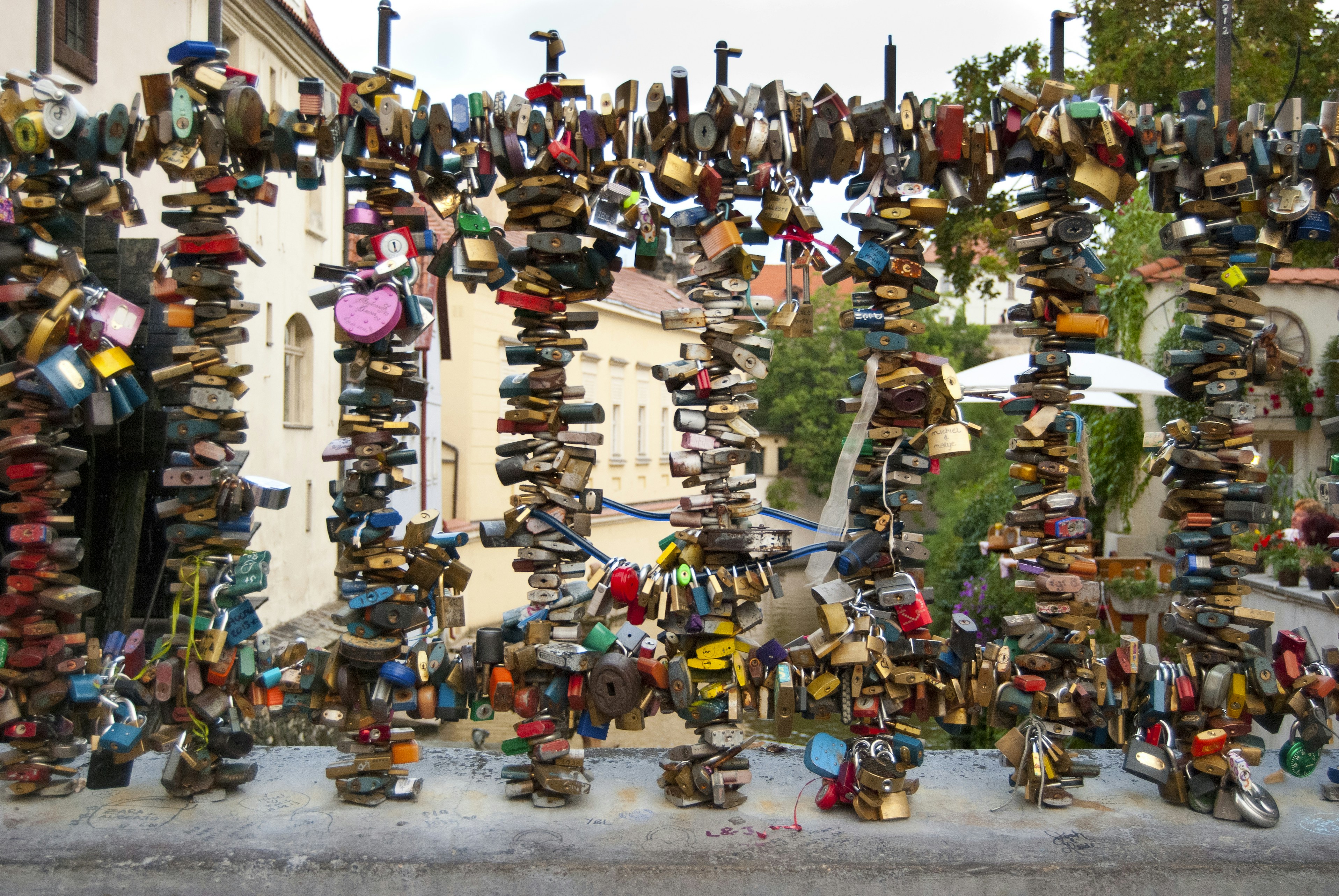 a bunch of shoes that are hanging on a wall