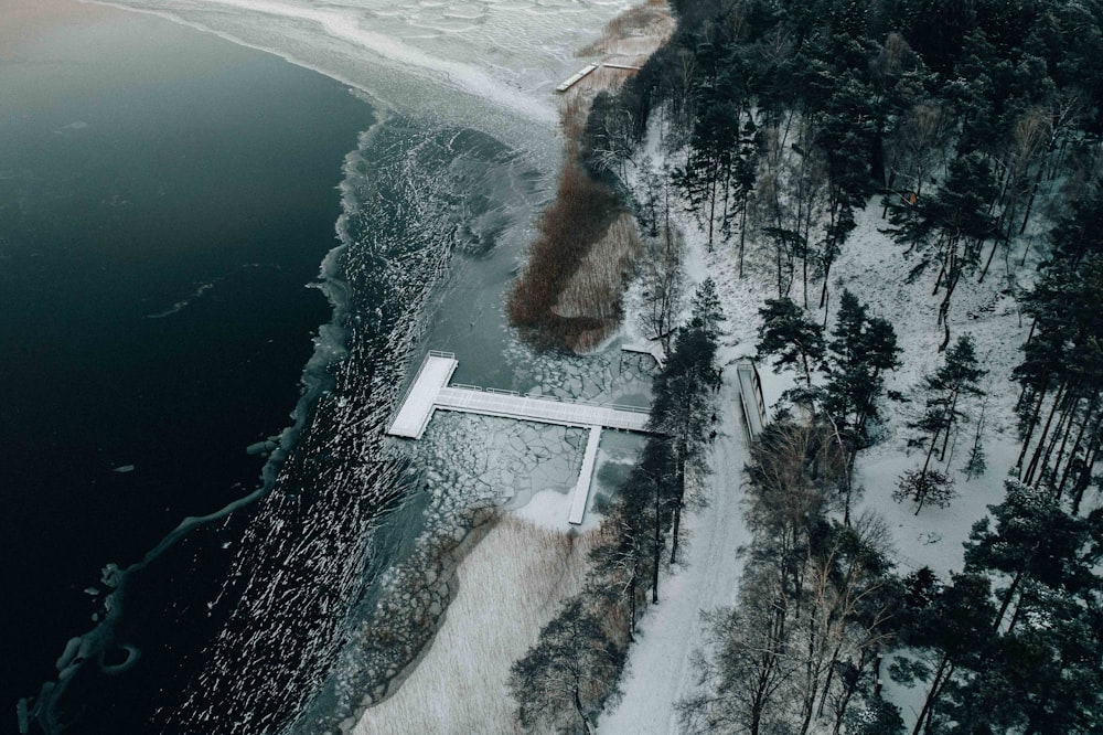 an aerial view of a body of water surrounded by trees