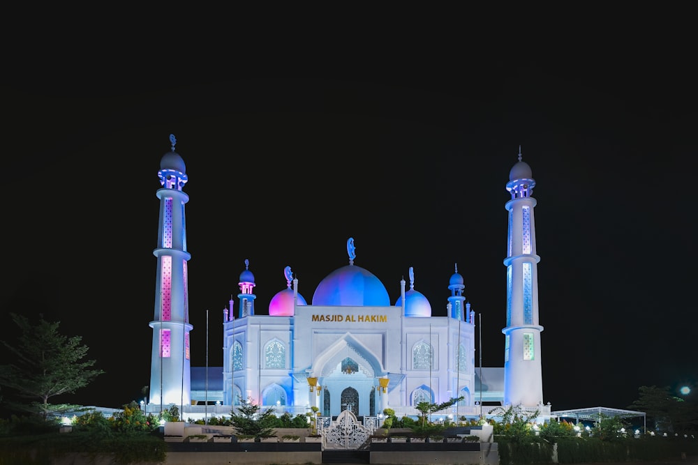 a large white building lit up at night