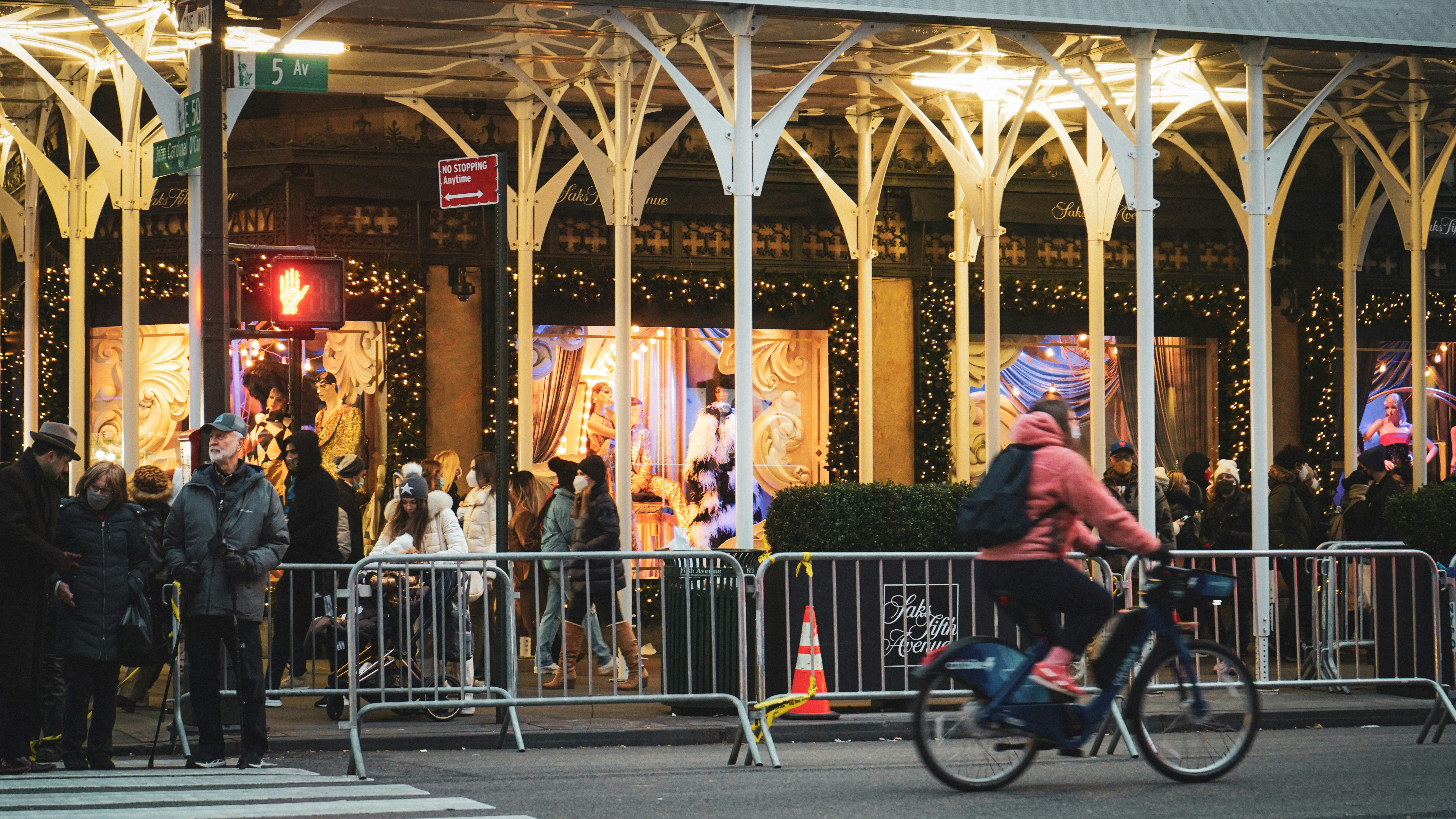 a person riding a bike down a street