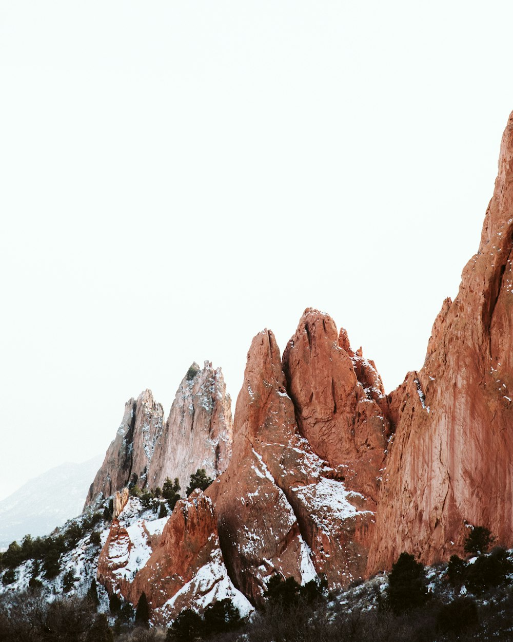 a group of mountains with snow on them