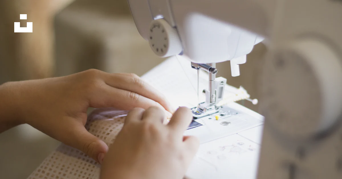 Person Using Stitching Machine A close up of a person using a sewing machine photo – Free Child Image ...
